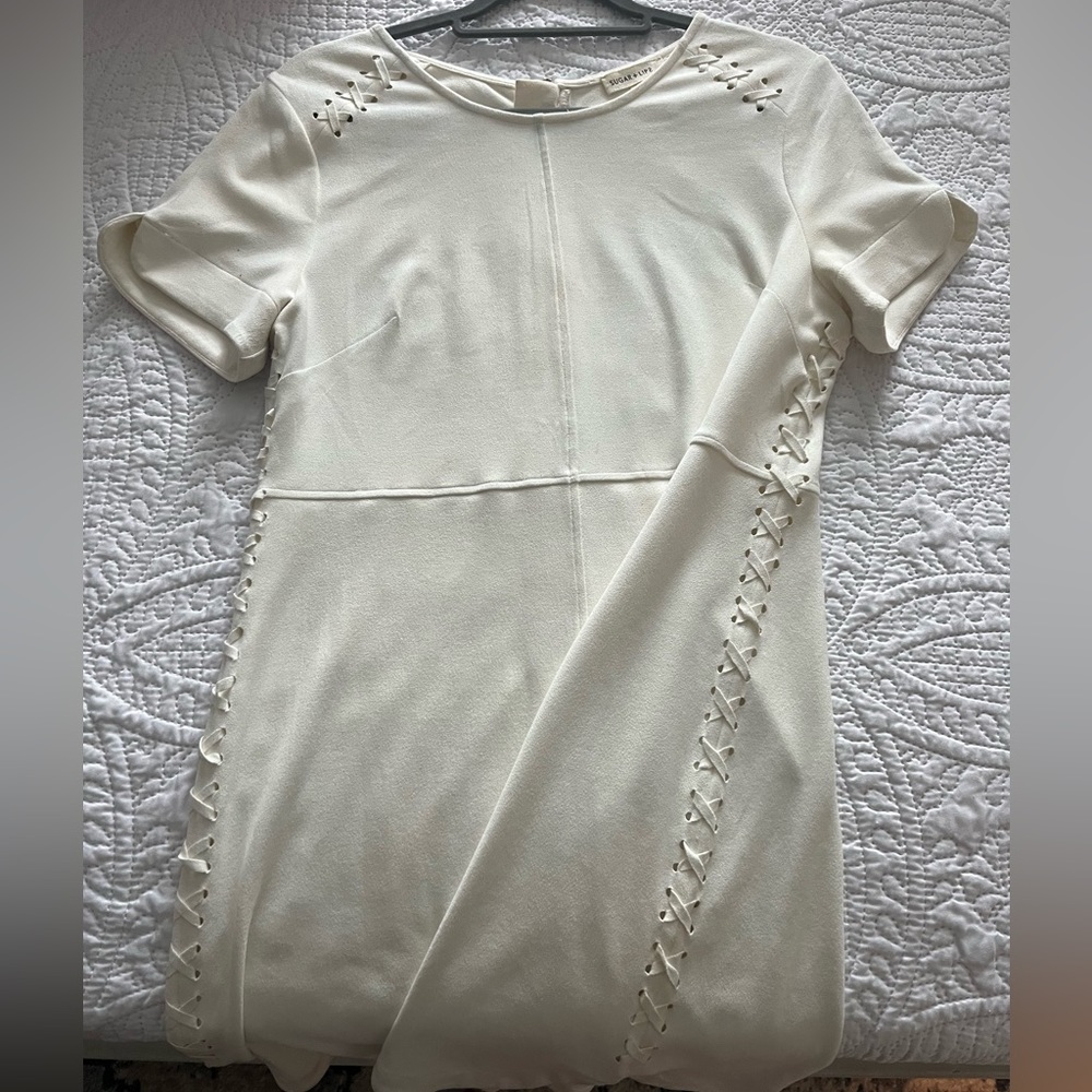 White dress with side stitching details